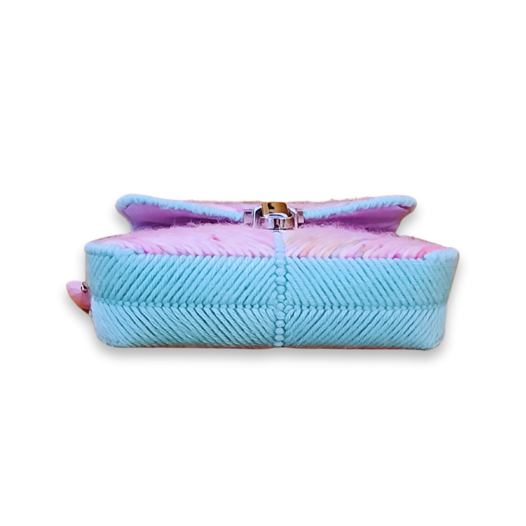 Bottom view of the structured base, showing the precise light blue stitching and the sturdy construction of the bag's foundation.