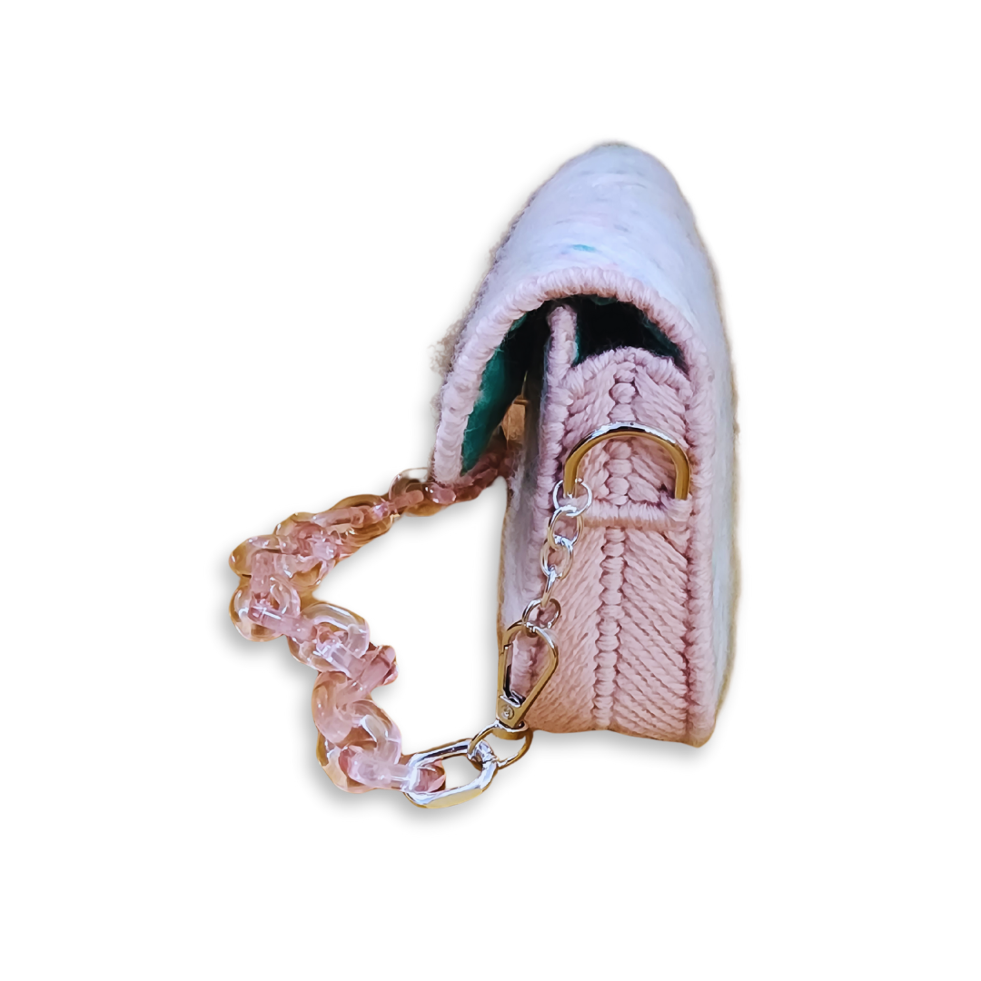 Side profile of a rigid internal frame purse demonstrating the durable embroidery technique and customizable strap with lobster claw attachments.