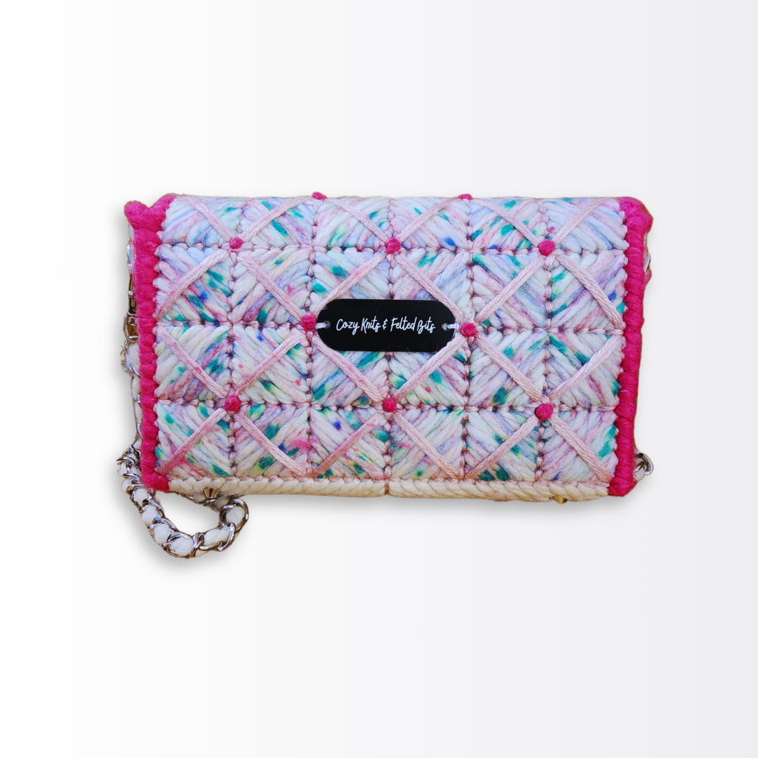 Back view of the hand-embroidered bag showcasing the seamless transition of the checkered pattern and the Cozy Knits & Felted Bits logo plate centered on the whimsical fiber design.