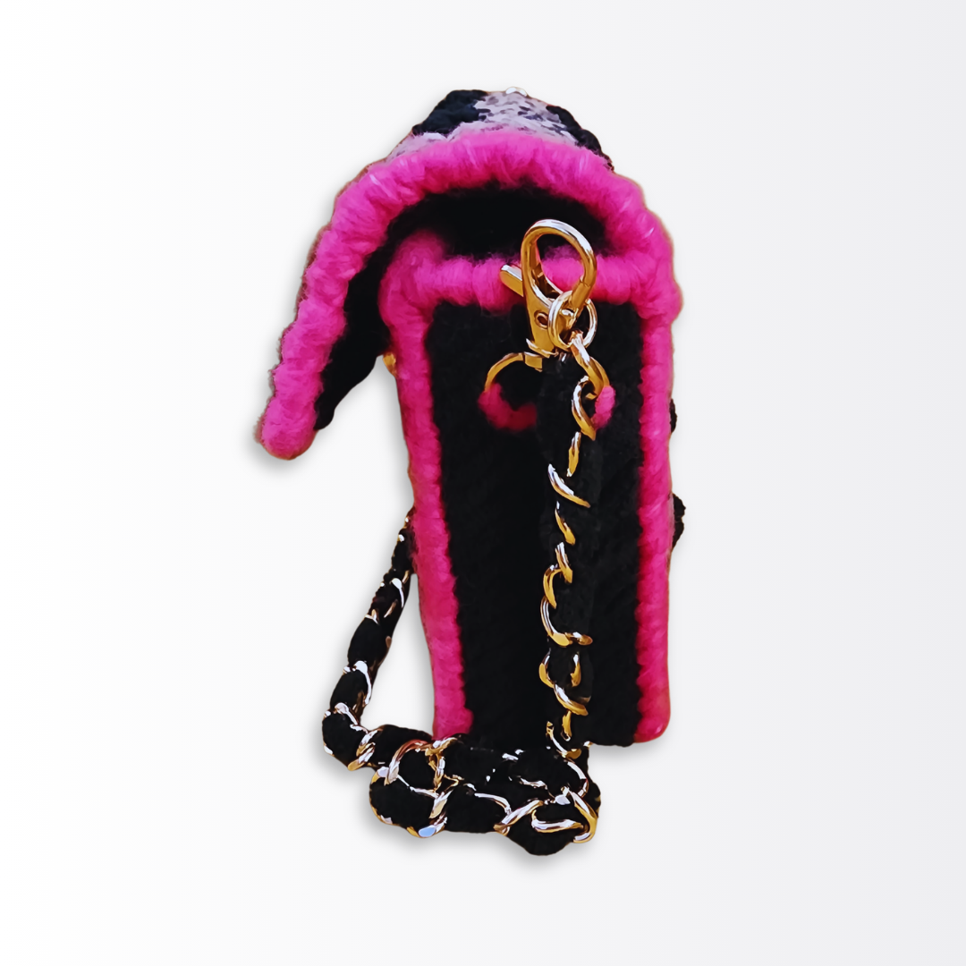 Side profile of the Leopard Mini Clutch highlighting the 2-inch depth and the vibrant hot pink fuzzy yarn border.
