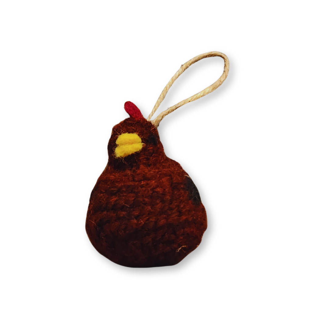 A front view of the Rhode Island Red chicken bobble, showing its dark reddish-brown felted body and yellow beak, isolated on a white background.