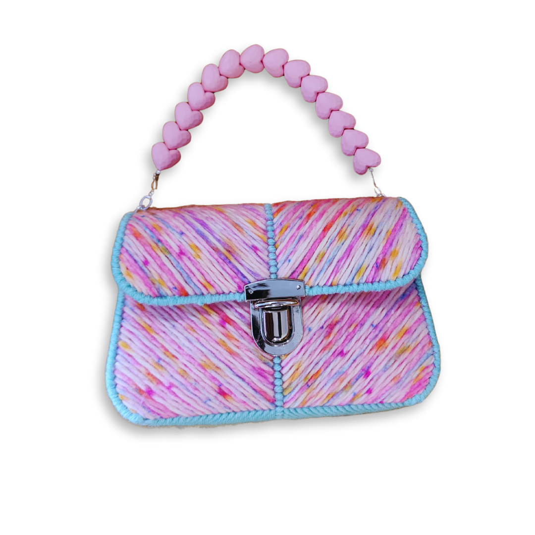 Full front view with the pink heart handle standing upright, displaying the bag's ability to maintain its whimsical silhouette.