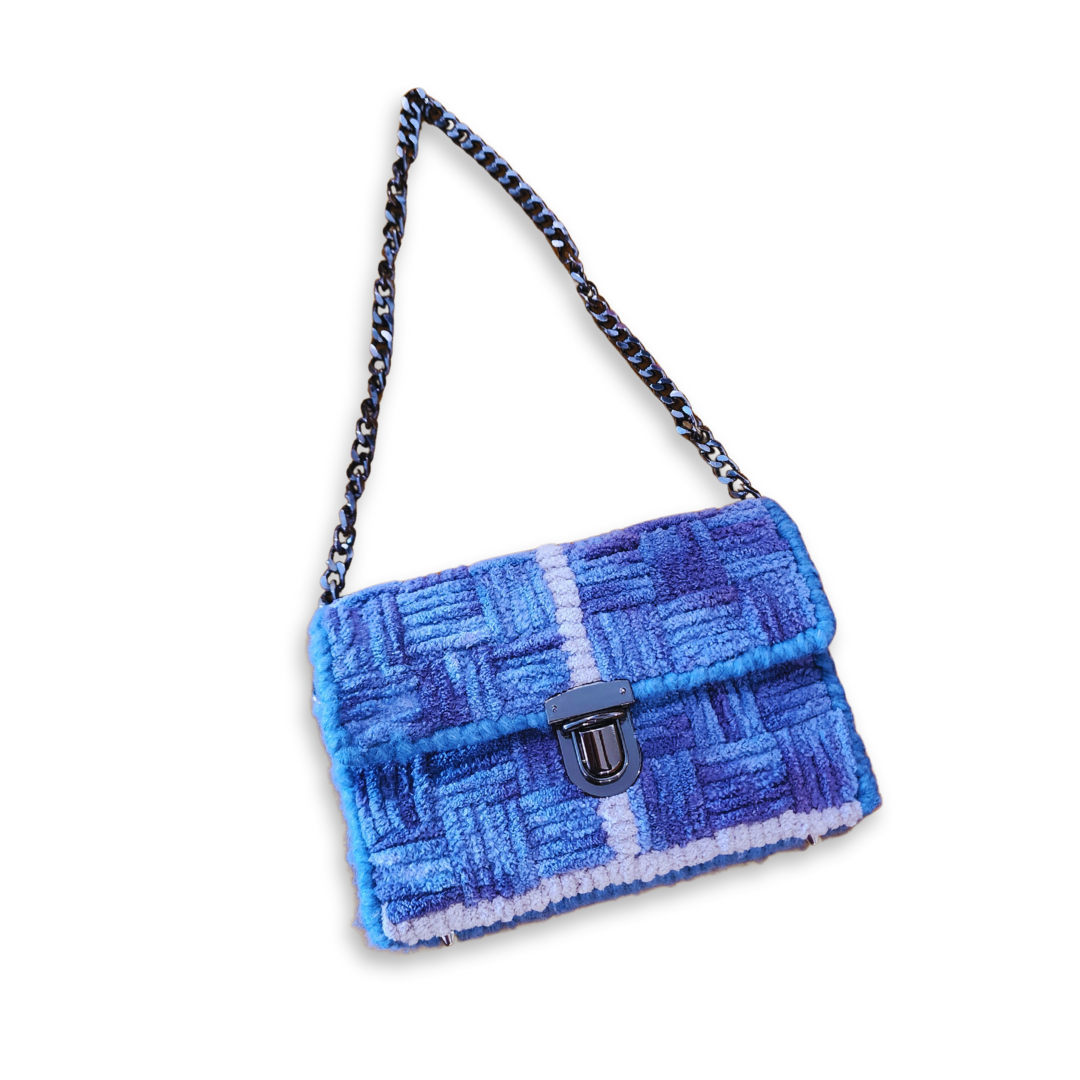Full front view of the Galaxy Checker Mini Clutch with the gunmetal chain strap extended. The basketweave pattern and structured fiber bag construction are displayed against a clean background.