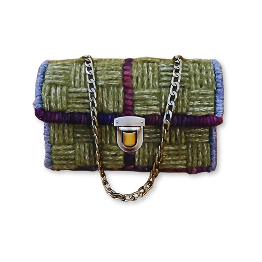 Front view of the Cottagecore Checkerboard Mini Clutch showcasing a moss green checkerboard stitch with a bronze push lock clasp and a bronze chain strap.