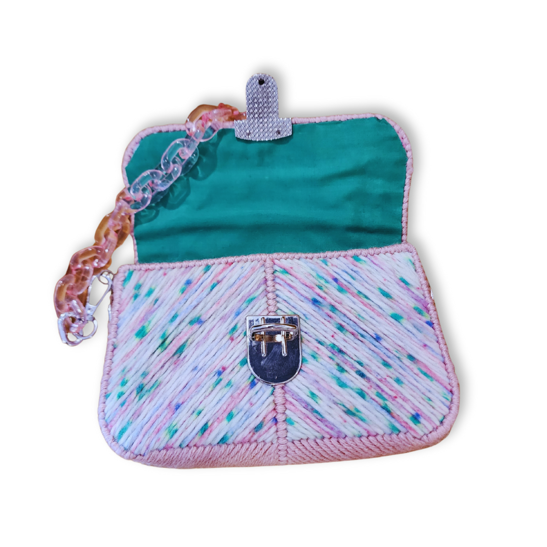 Interior view of the Green Pop-Rock Candy Mini Clutch showing the hand-sewn bright green cotton fabric lining. The silver hardware and lobster claw attachments are highlighted.