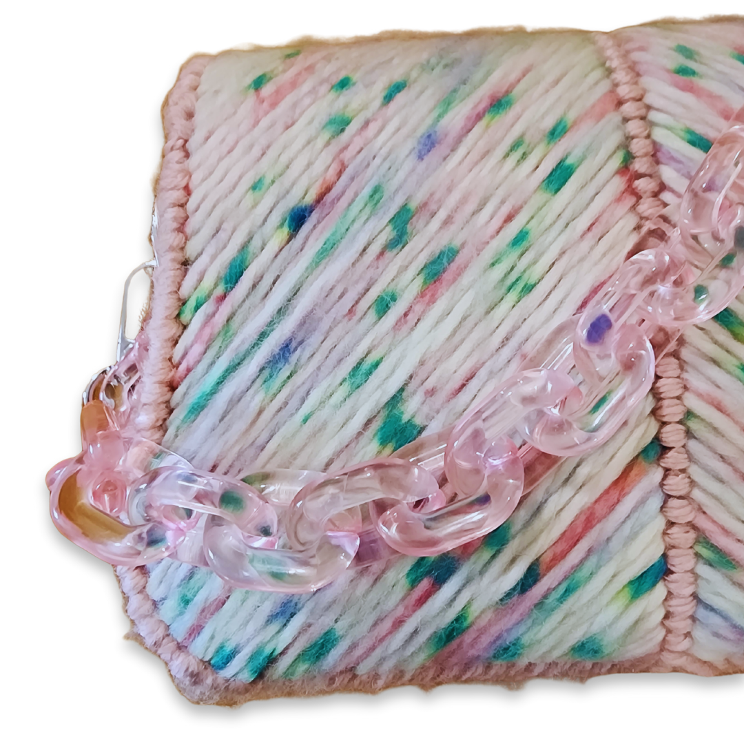 Macro shot of the Green Pop-Rock Candy exterior, focusing on the texture-rich design of the pink acrylic chain against the chevron pattern.