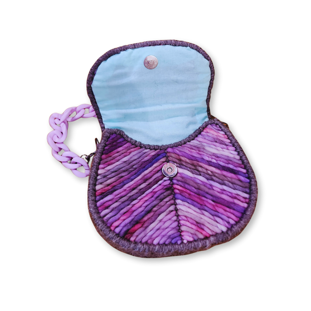 Interior view of the Lavender Dream Saddlebag opened to reveal the hand-sewn light blue cotton fabric lining and a secure gunmetal magnetic snap closure.