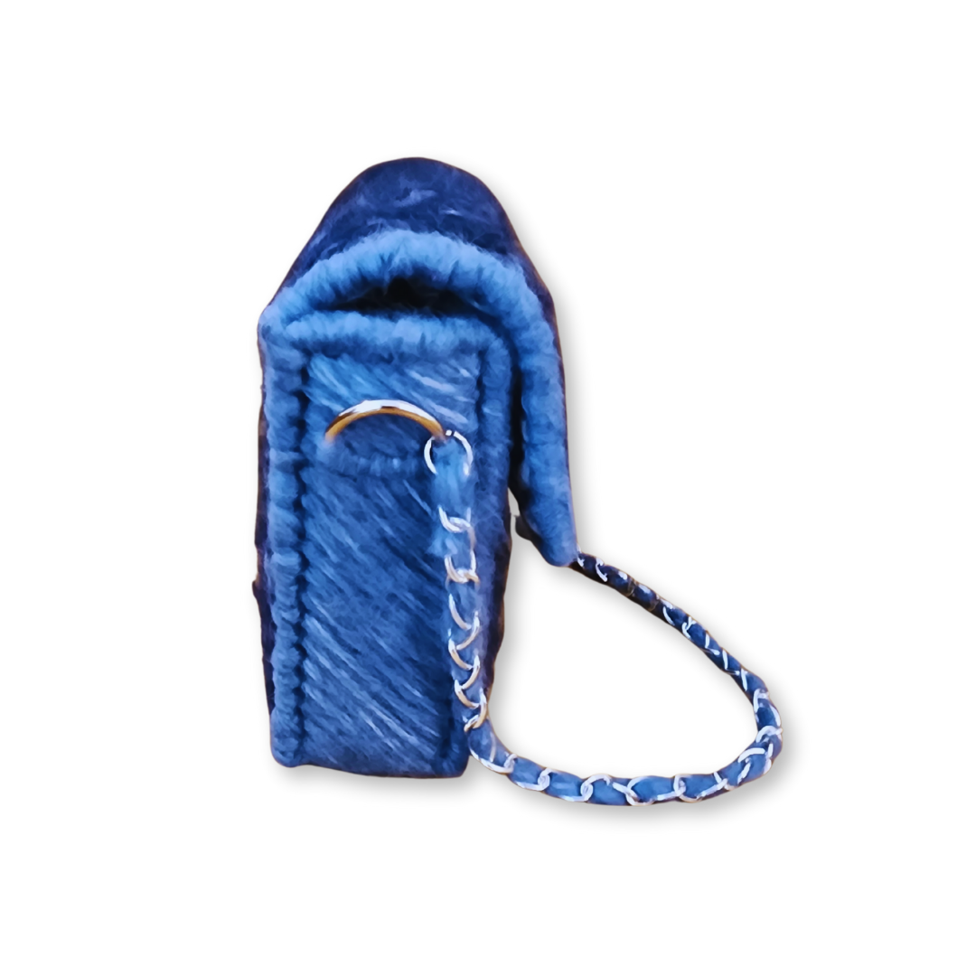 Side profile of the mini clutch demonstrating the 2-inch depth and the professional rigid internal frame construction with a silver lobster claw strap attachment.