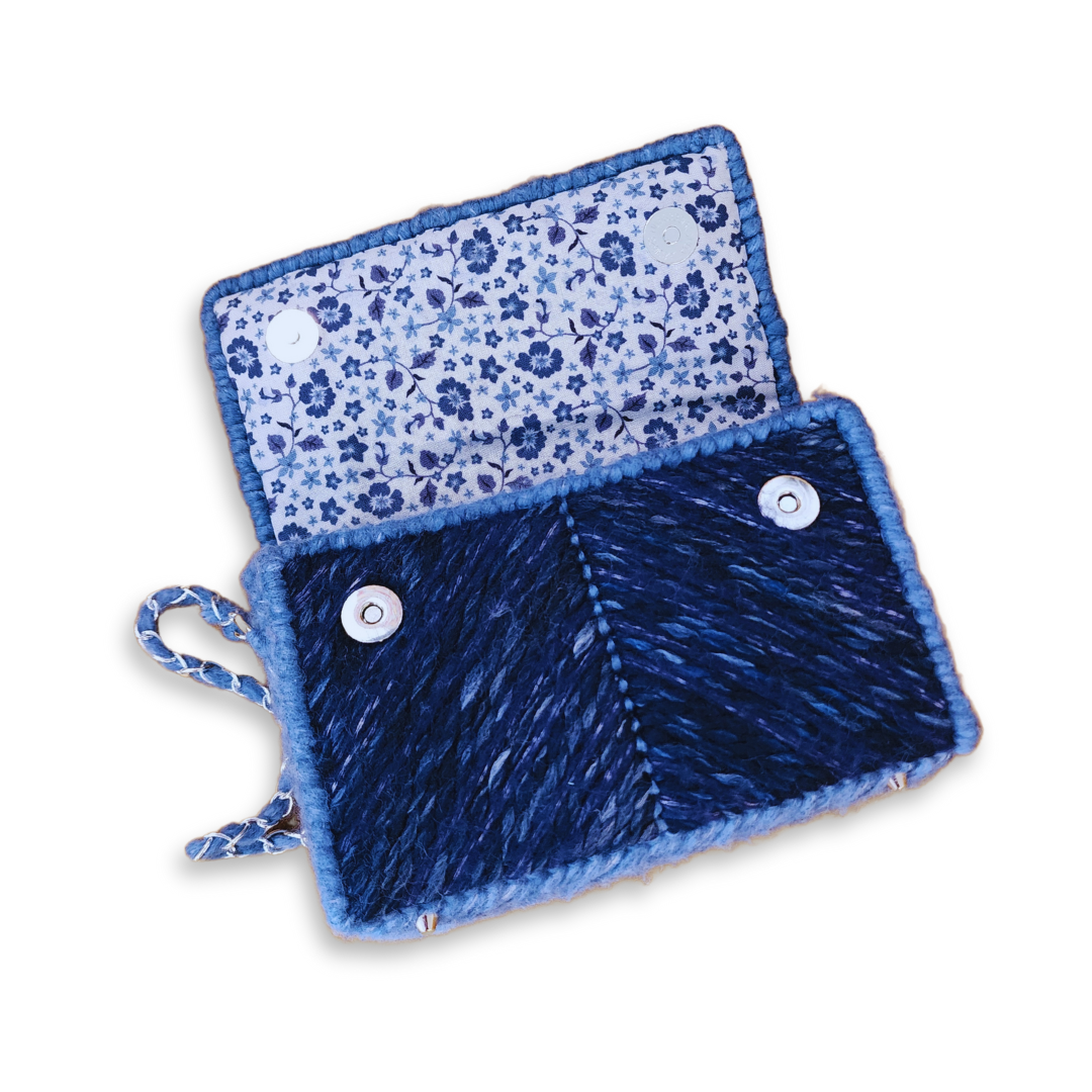 Close-up of the floral cotton interior and silver hardware, emphasizing the high-end hand-sewn finishing and structural integrity.