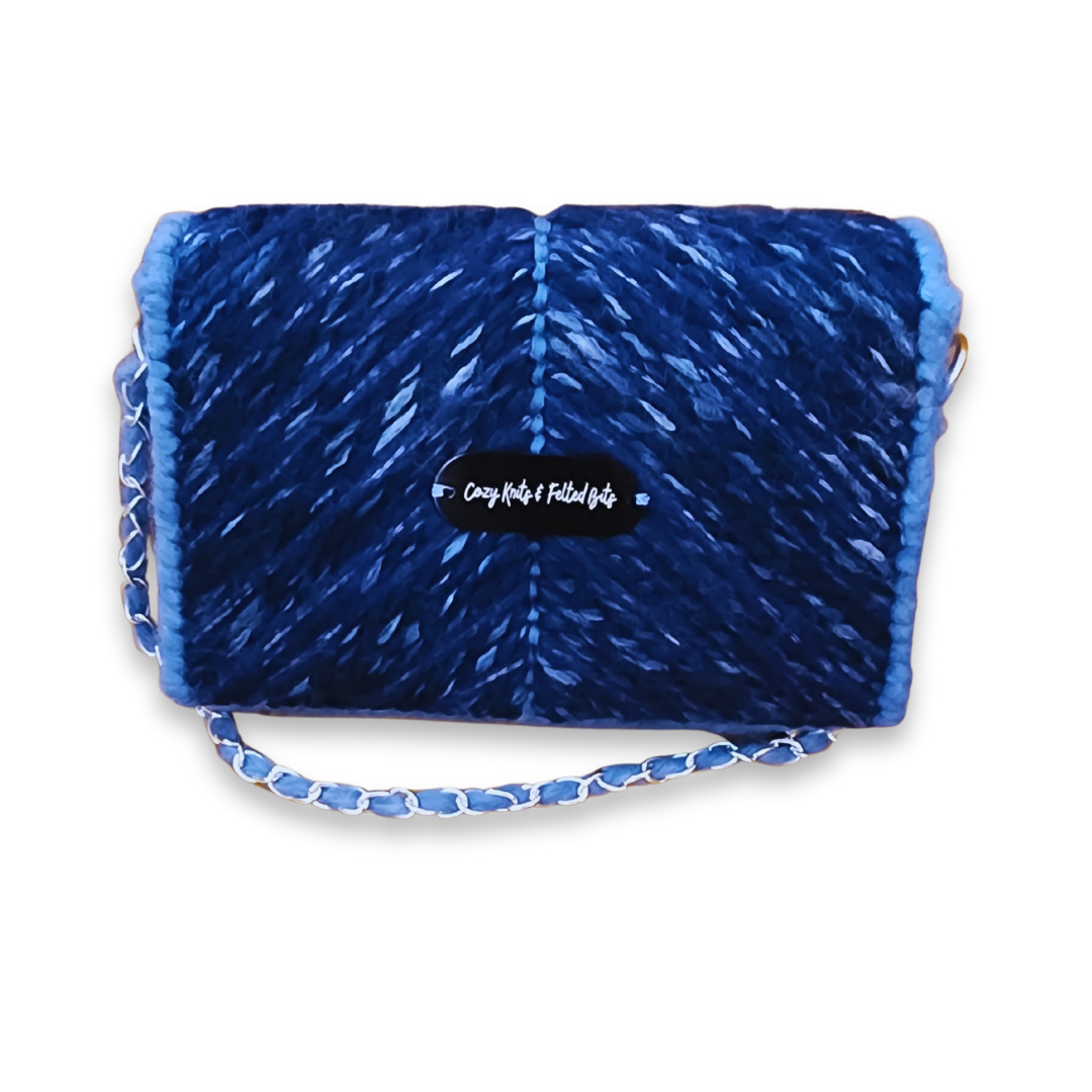 Back view of the Midnight Navy Clutch showcasing the seamless continuation of the chevron stitch and the CKFB Original logo plate.