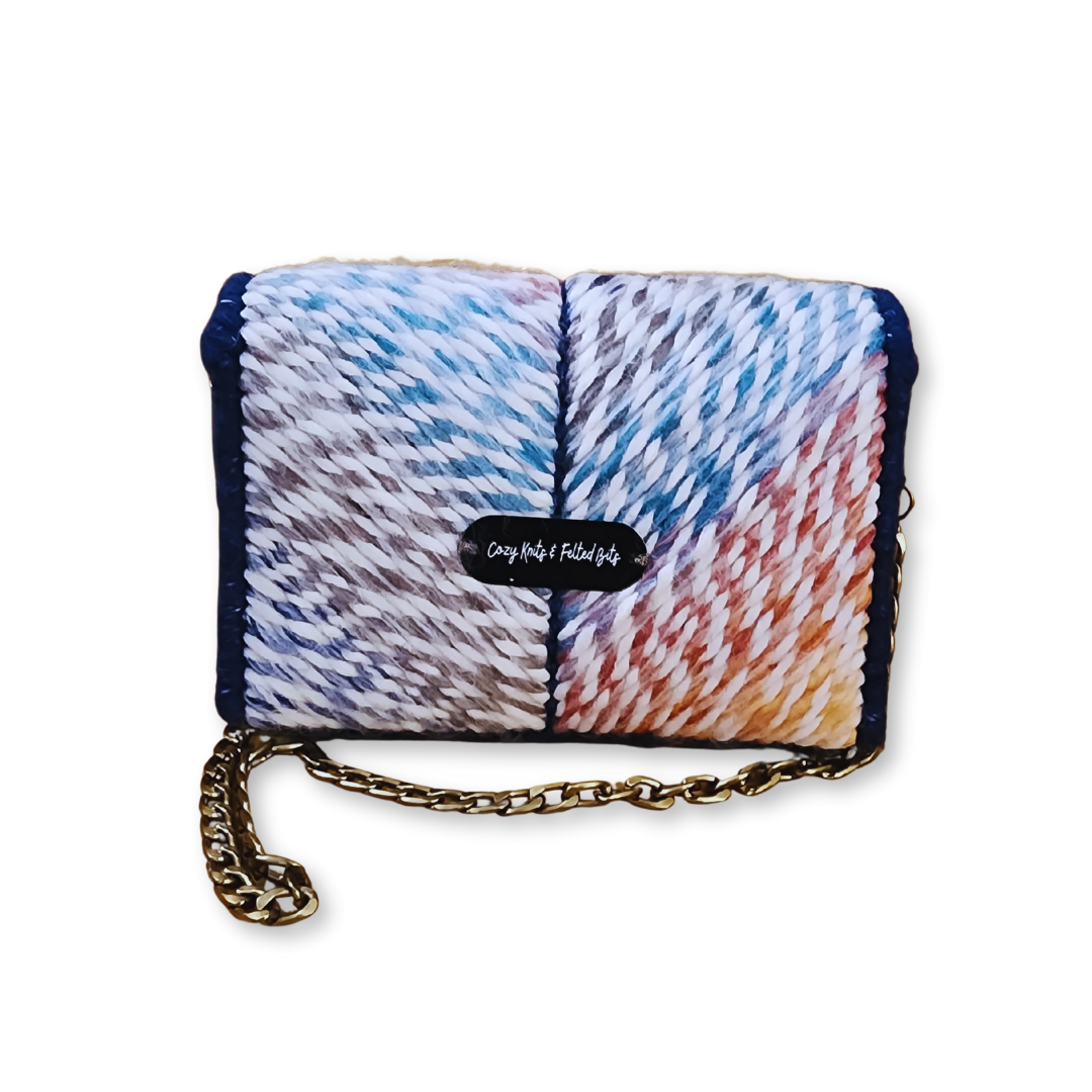 Back view of the structured fiber bag featuring the CKFB Original logo plate. The mauve rainbow ombre yarn continues seamlessly across the one-of-a-kind design.