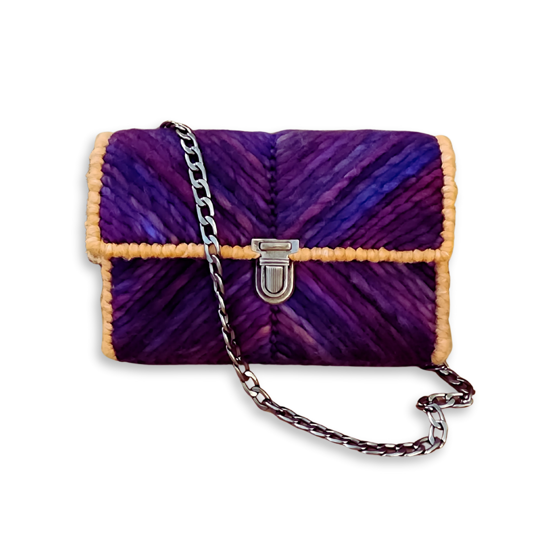 Front view of the OOAK Purple Chevron Mini Clutch showcasing a hand-embroidered chevron pattern in deep purple and blue hand-dyed merino wool. The design is secured with an ornate bronze push-lock clasp and features a matching 9mm bronze chain strap.
