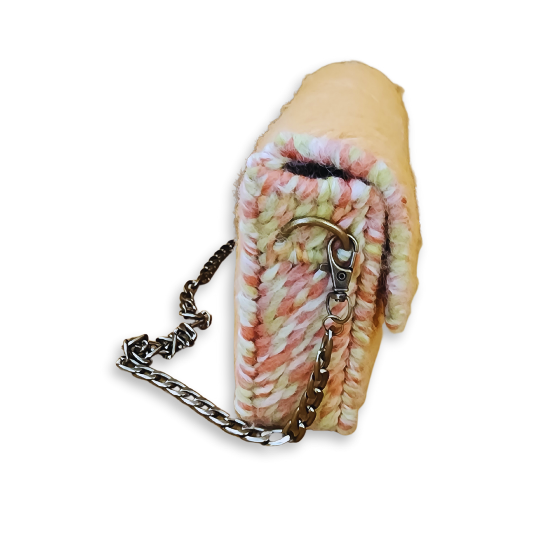 Side profile shot demonstrating the 2-inch depth and the rigid internal frame that allows the clutch to maintain its sharp silhouette. The lobster claw attachment on the bronze chain is clearly visible.