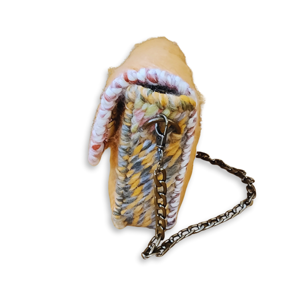 Close-up of the ombre green and yellow yarn side panels, showcasing the attention to detail and multi-textured construction of this whimsical statement bag.