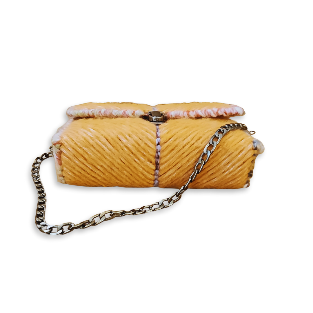 Overhead view of the Golden Honey Clutch highlighting the high-density stitching and the seamless integration of the ombre yarn accents along the top edge.