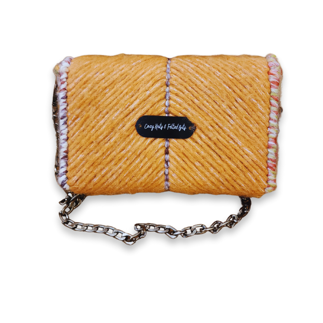 Back view of the structured mini handbag featuring the CKFB Original logo plate. The chevron pattern continues across the back, demonstrating the one-of-a-kind artisan quality.