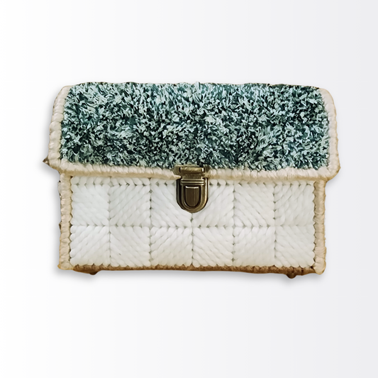 Front-facing view of the Astro Turf Bargello Mini Bag highlighting the green chenille "turf" flap and the ornate bronze push-lock clasp.