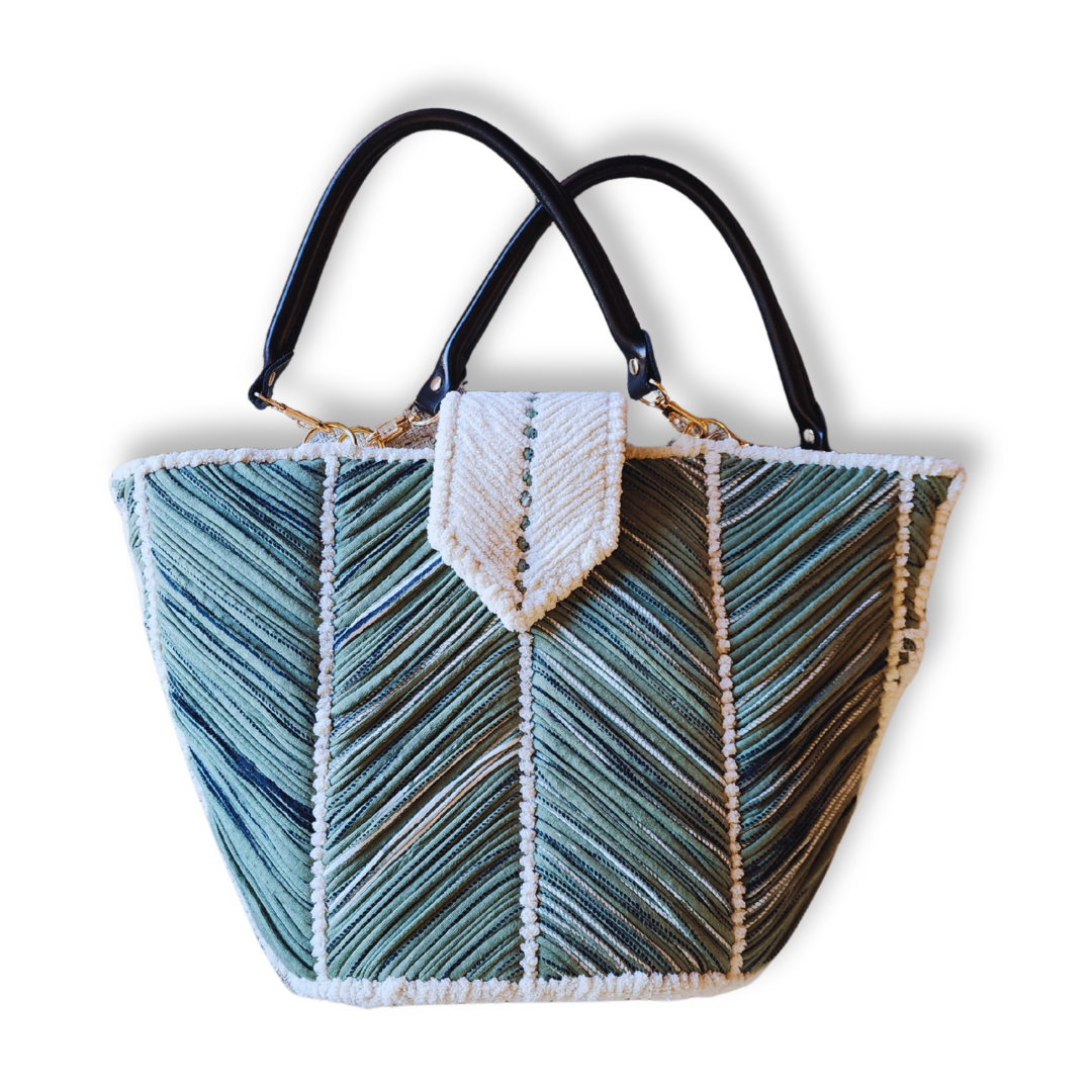 A large, handmade embroidered tote bag in shades of green and white with a chevron pattern. It has black leather handles, a white chenille trim, and a magnetic flap closure.