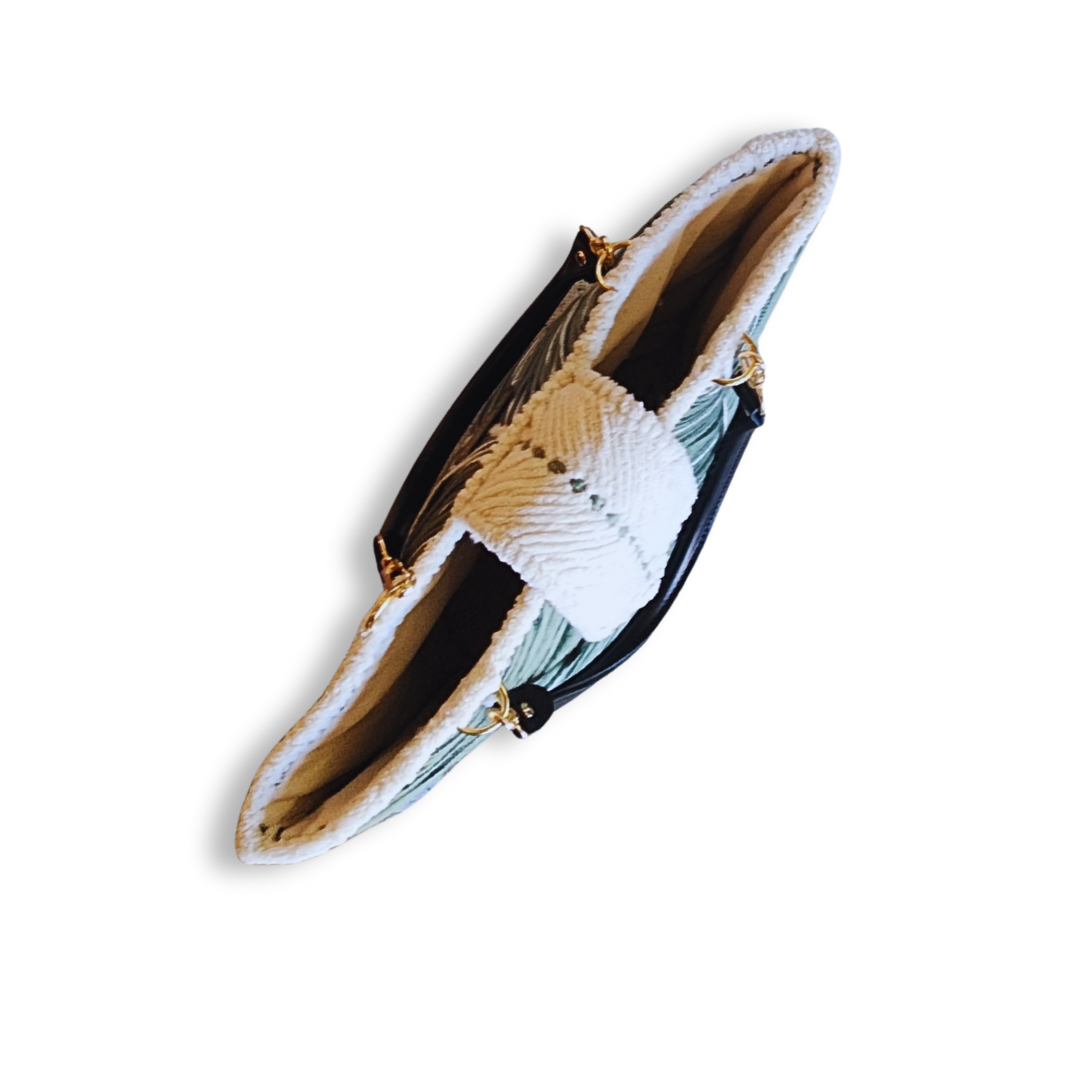 A top-down view of the tote bag with the opening facing the camera, showing the narrow profile of the angled bag and the interior lining.