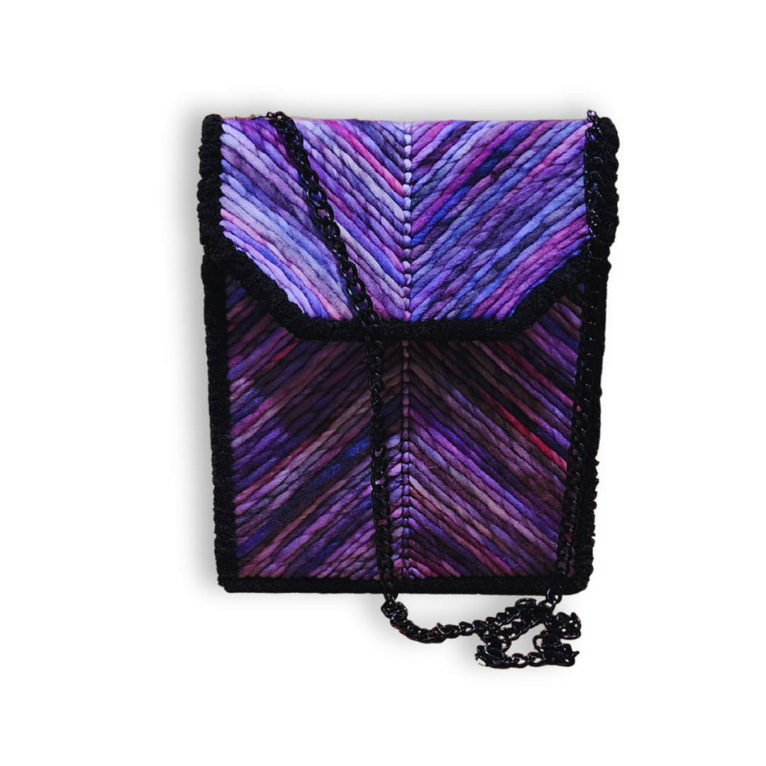 A front view of the embroidered bag, showcasing the vibrant purple and pink ombre vertical stripes and the black/gunmetal hardware.