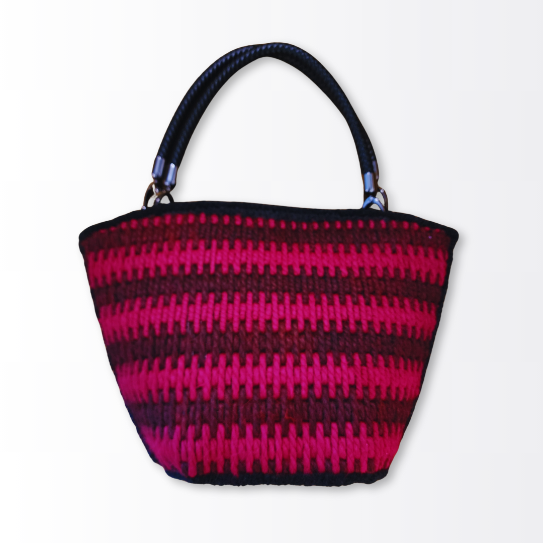  Full front view of the scalloped artisan tote displaying the rhythmic Bargello-style wave pattern.