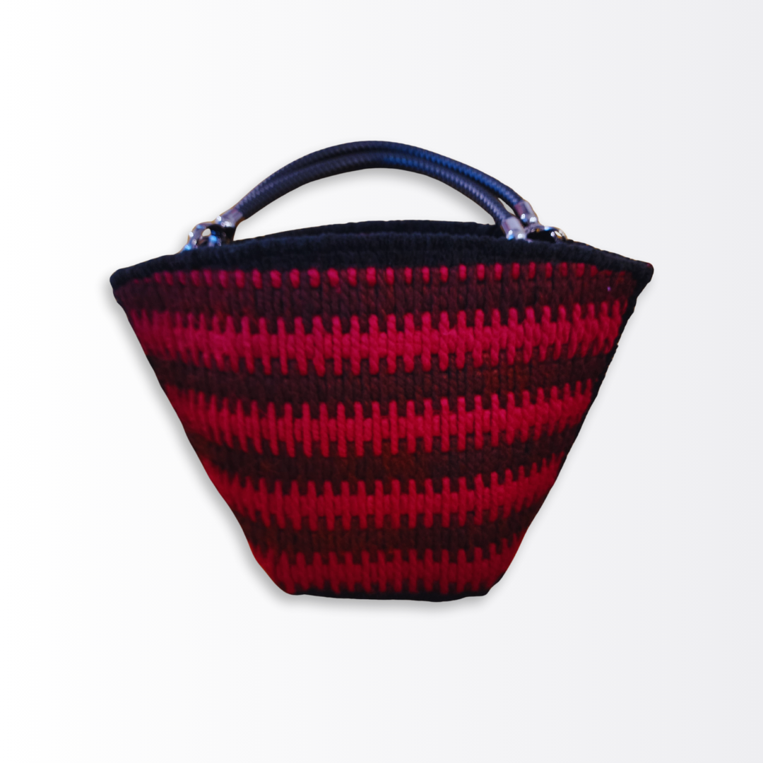Full angled view of the Crimson Eclipse Scalloped Artisan Tote showing the two-tone red Bargello stitch pattern and the professional, structured architectural silhouette from a side-front perspective.