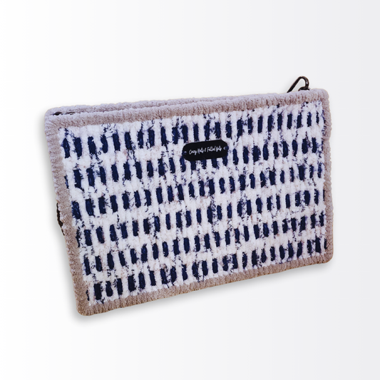 Front view of the Deep Sea Mosaic Artisan Crossbody ($169) highlighting the rhythmic two-tone pattern of navy blue yarn and seaside chenille with a soft grey chenille border.