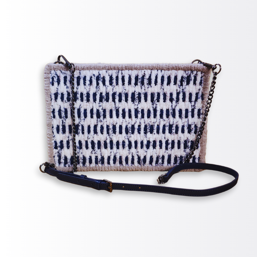 Full-length view of the structured crossbody bag showcasing the adjustable navy blue leather strap and 10mm black gunmetal chain accents.