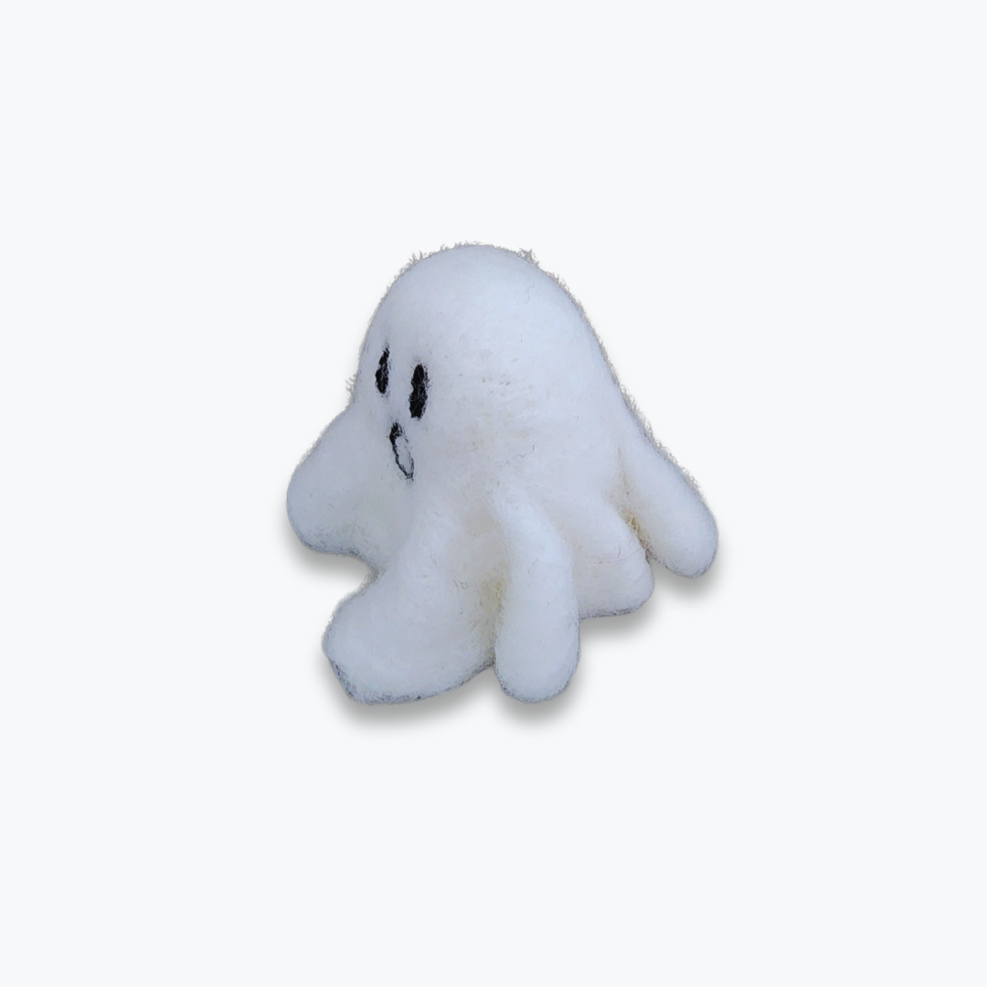 A large handmade felted ghost figurine with a surprised, open-mouthed expression and black eyes, viewed from a side angle against a plain white background.