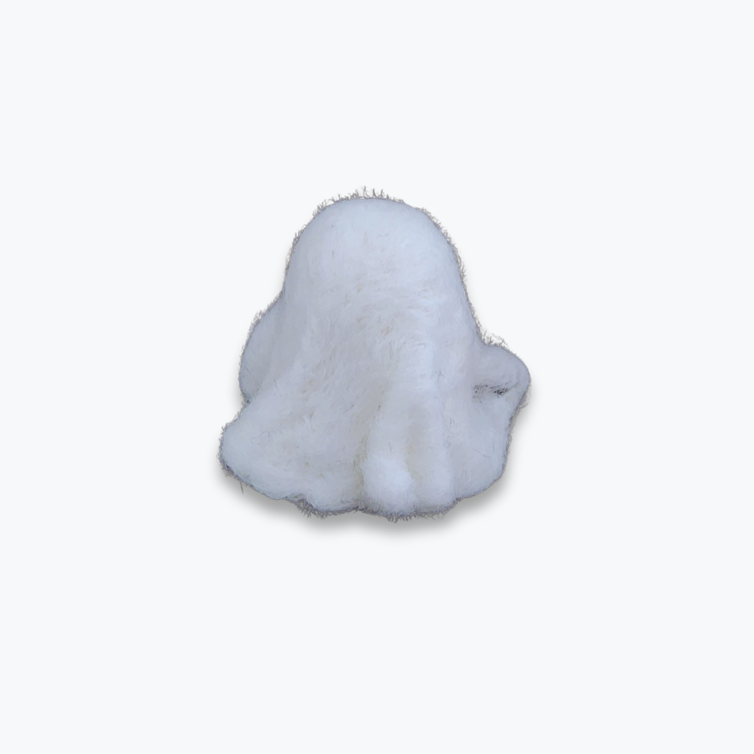 A large handmade felted ghost figurine with a surprised, open-mouthed expression and black eyes, viewed from a high angle against a plain white background.