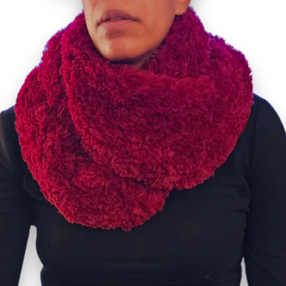 A close-up view of the maroon faux fur infinity scarf looped twice around the neck.