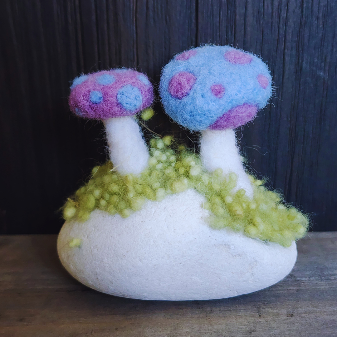 Handmade Felt Magic Mushrooms on White Granite Stone