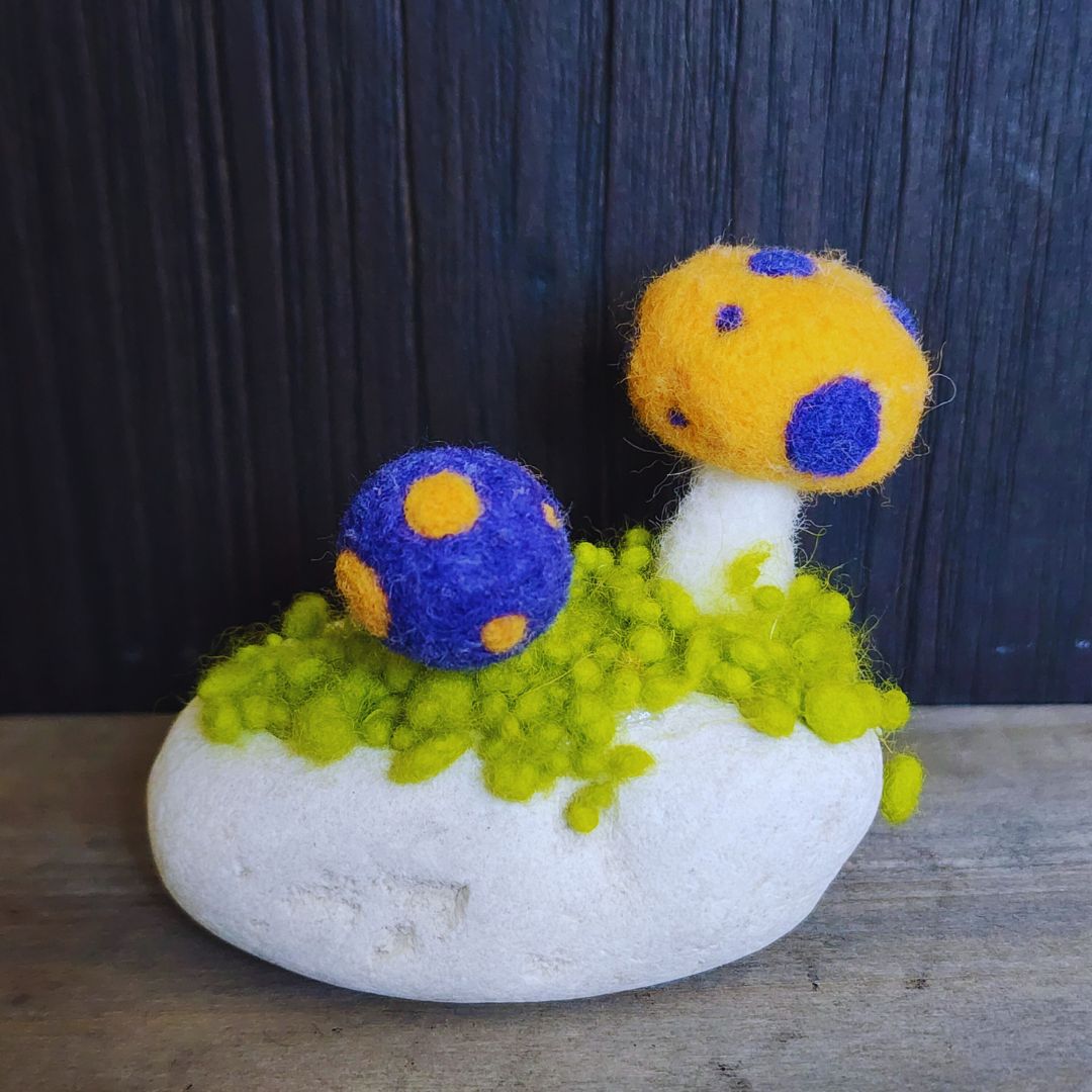 Handmade Felt Magic Mushrooms on White Granite Stone
