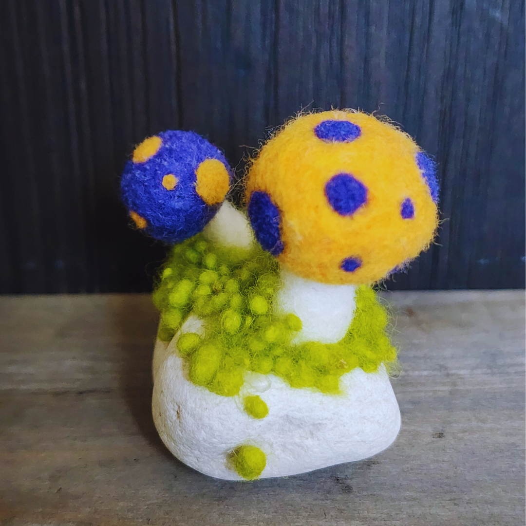 Handmade Felt Magic Mushrooms on White Granite Stone