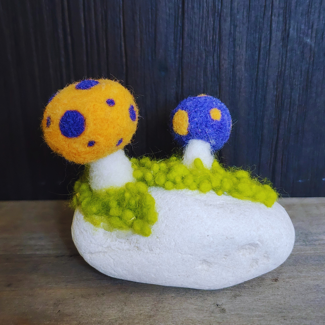 Handmade Felt Magic Mushrooms on White Granite Stone