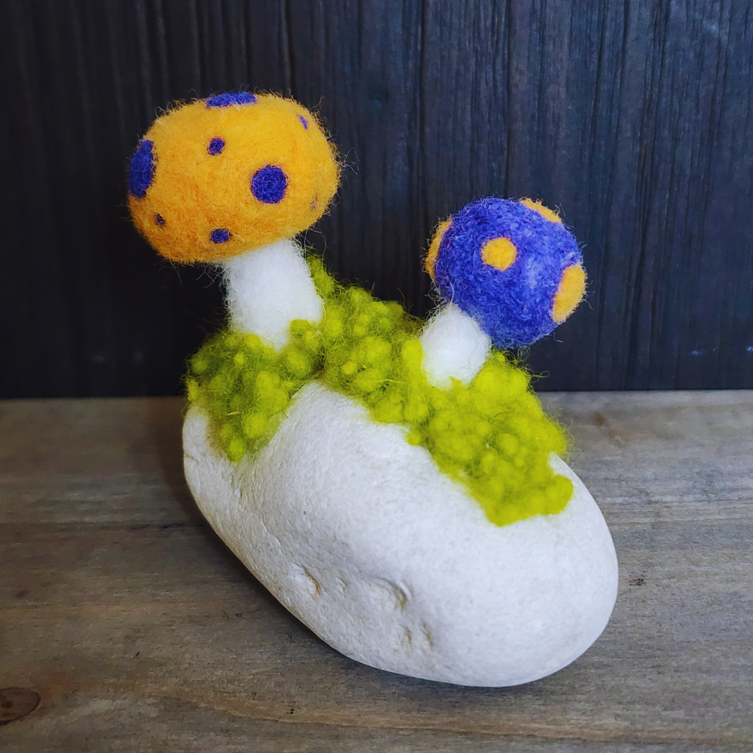 Handmade Felt Magic Mushrooms on White Granite Stone