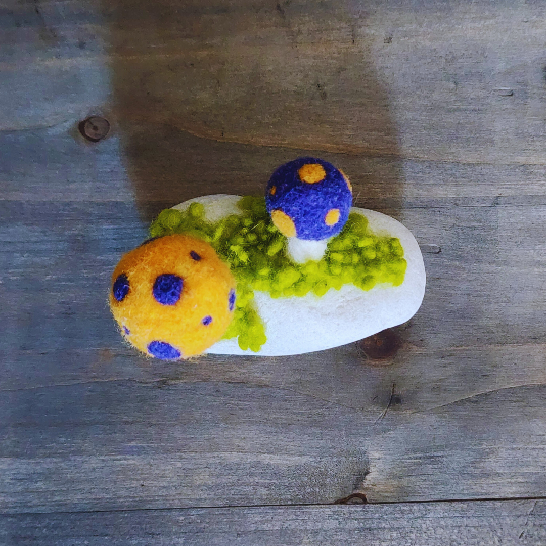 Handmade Felt Magic Mushrooms on White Granite Stone