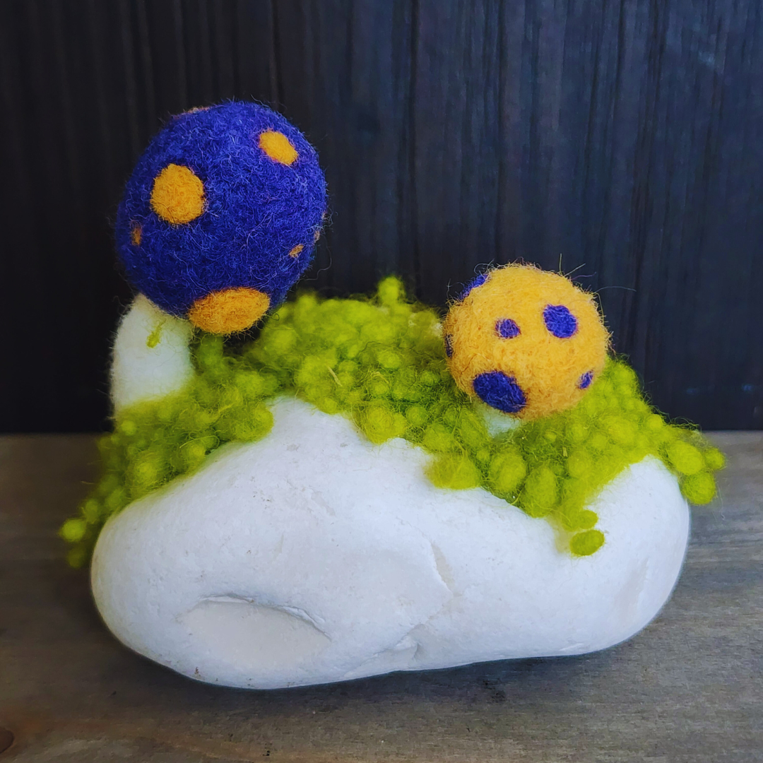 Handmade Felt Magic Mushrooms on White Granite Stone