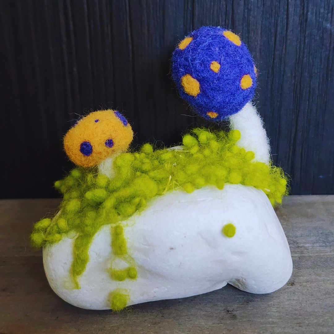 Handmade Felt Magic Mushrooms on White Granite Stone