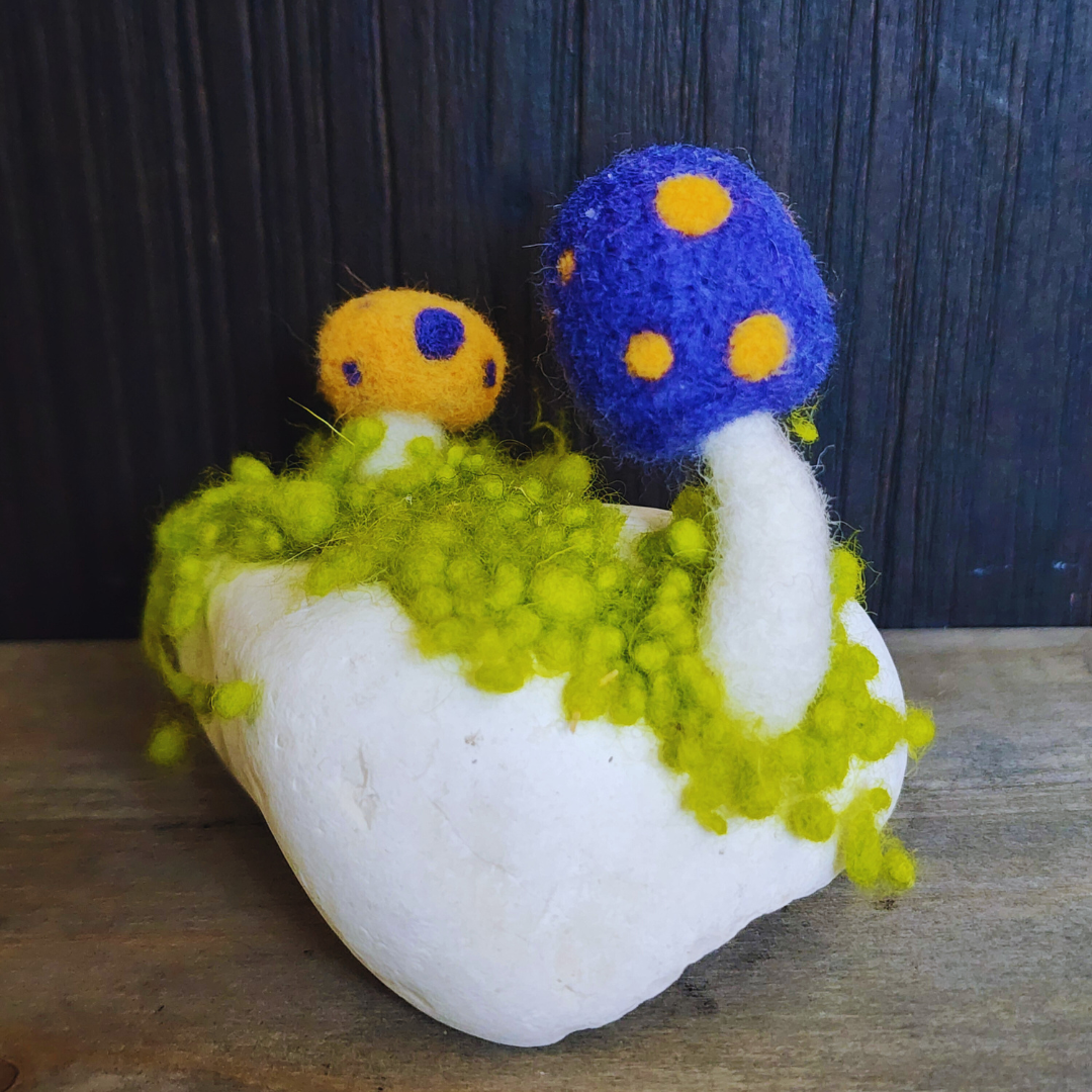 Handmade Felt Magic Mushrooms on White Granite Stone