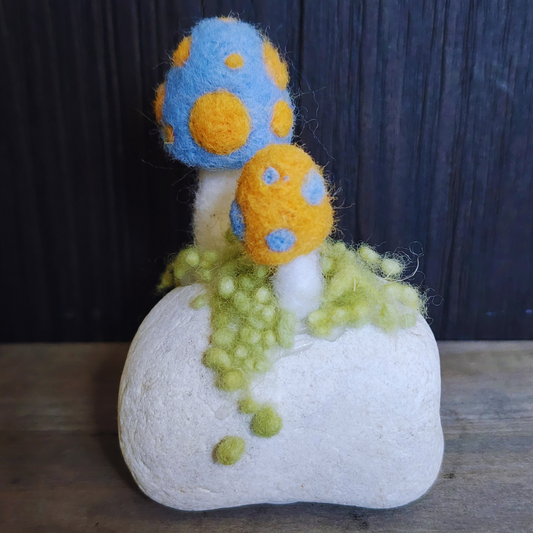 Handmade Felt Magic Mushrooms on White Granite Stone