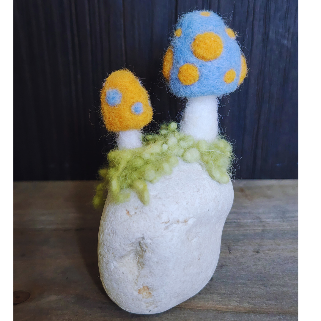 Handmade Felt Magic Mushrooms on White Granite Stone
