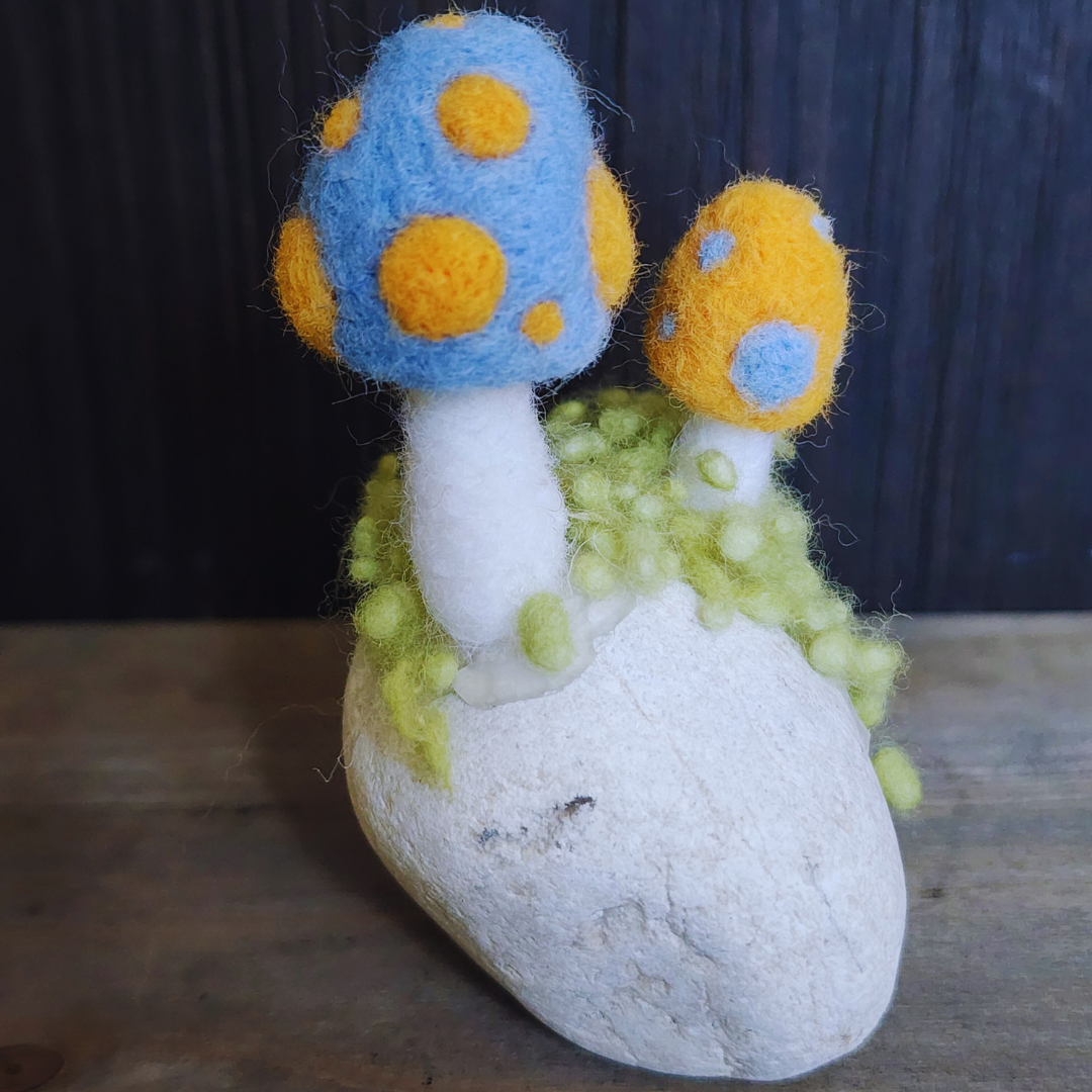 Handmade Felt Magic Mushrooms on White Granite Stone