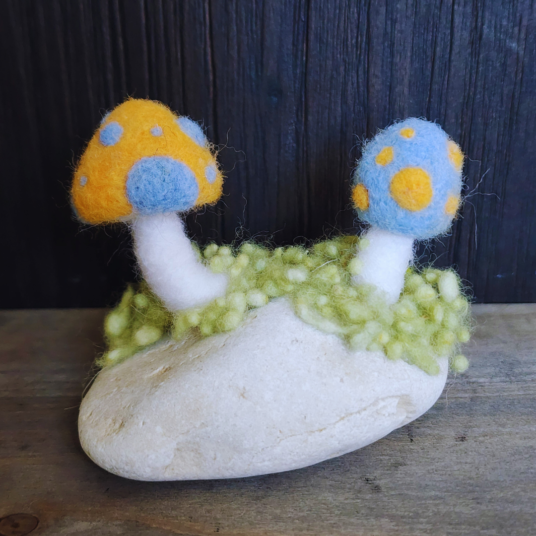 Handmade Felt Magic Mushrooms on White Granite Stone