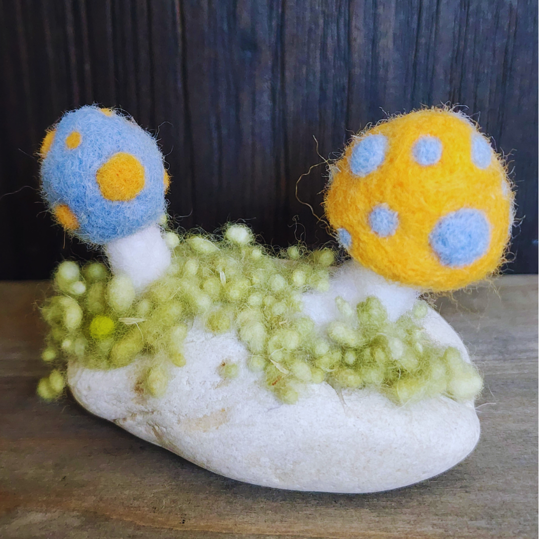 Handmade Felt Magic Mushrooms on White Granite Stone
