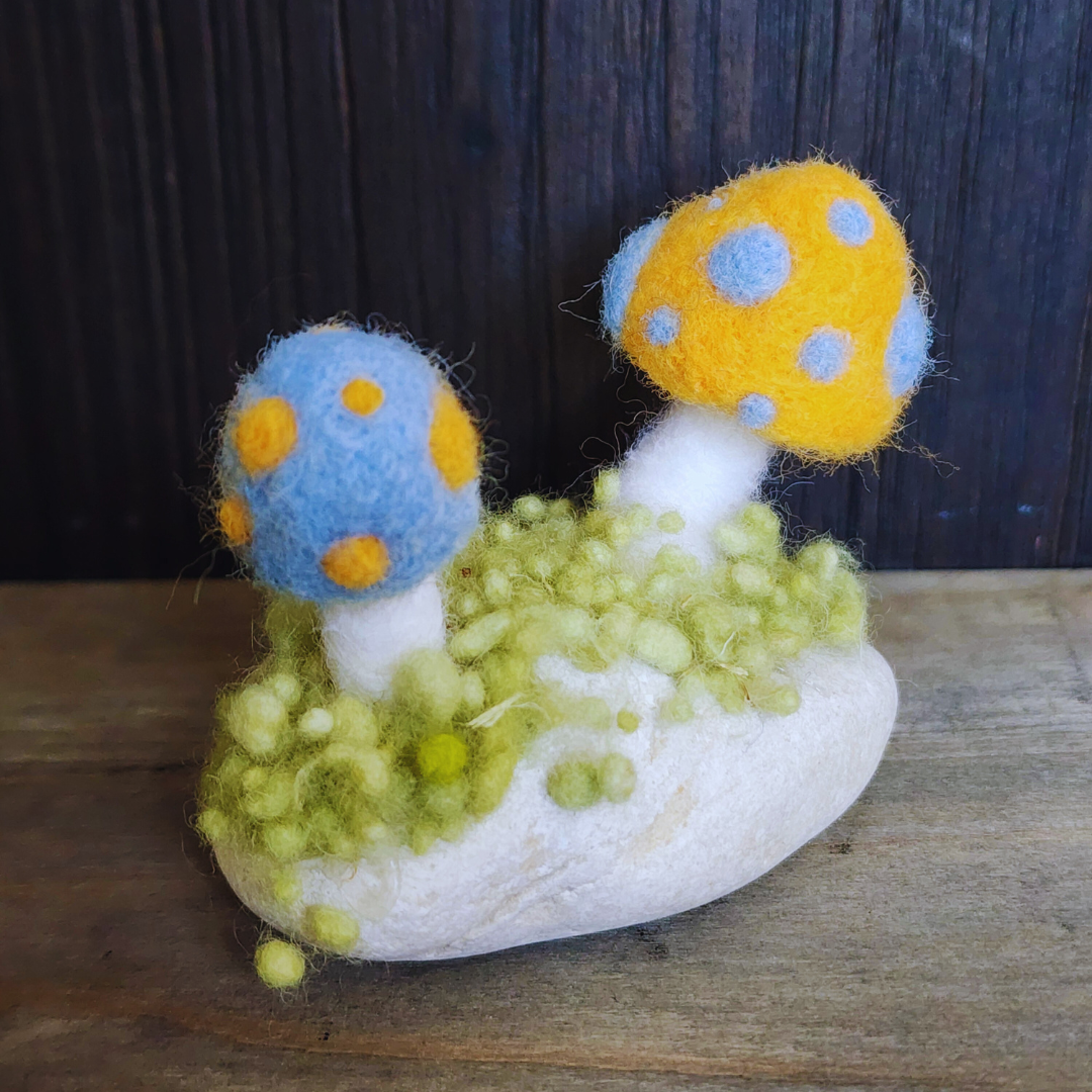 Handmade Felt Magic Mushrooms on White Granite Stone
