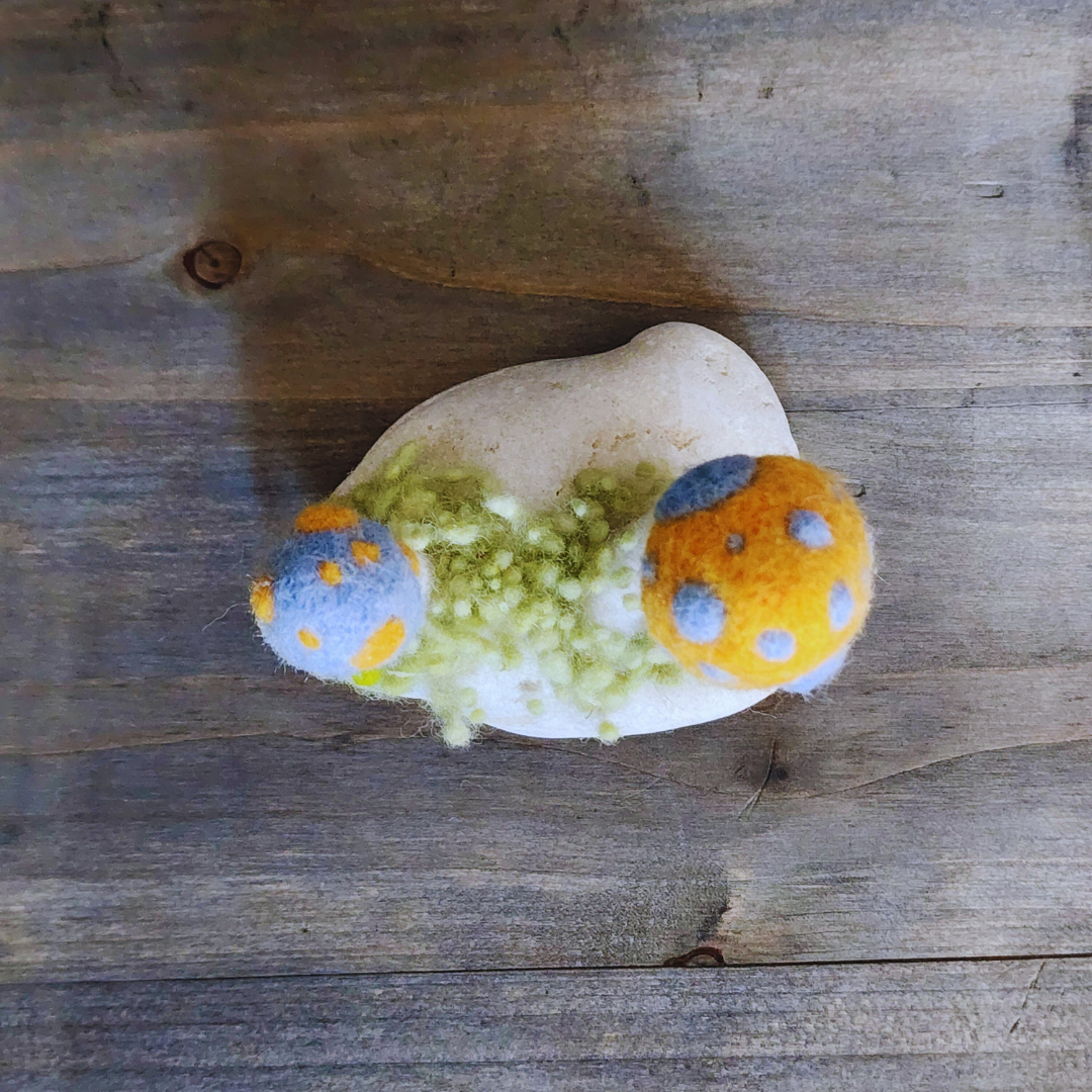 Handmade Felt Magic Mushrooms on White Granite Stone