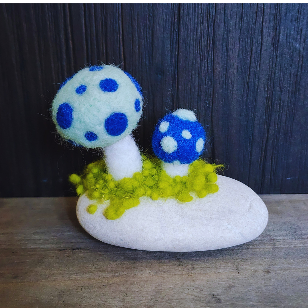 Handmade Felt Magic Mushrooms on White Granite Stone