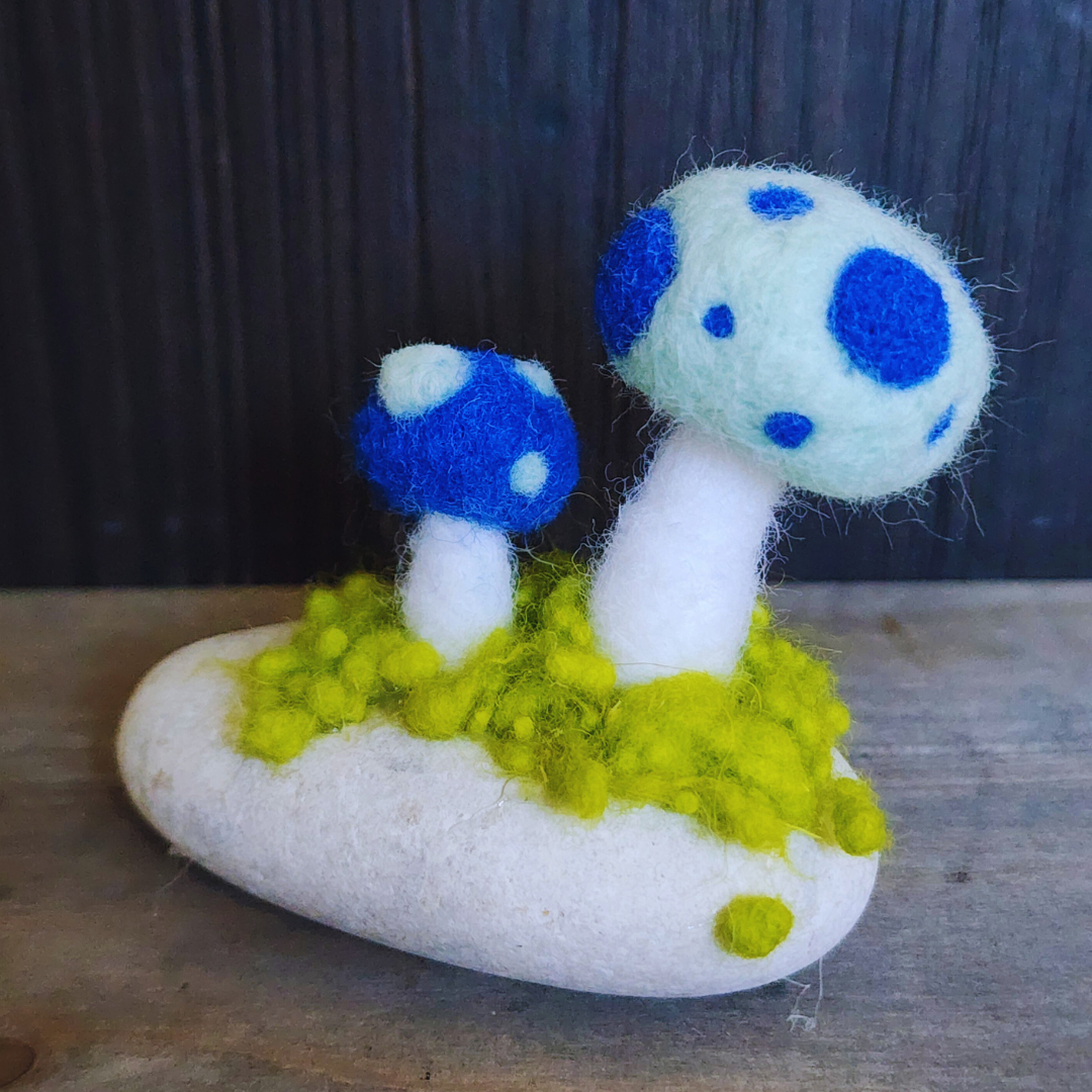 Handmade Felt Magic Mushrooms on White Granite Stone