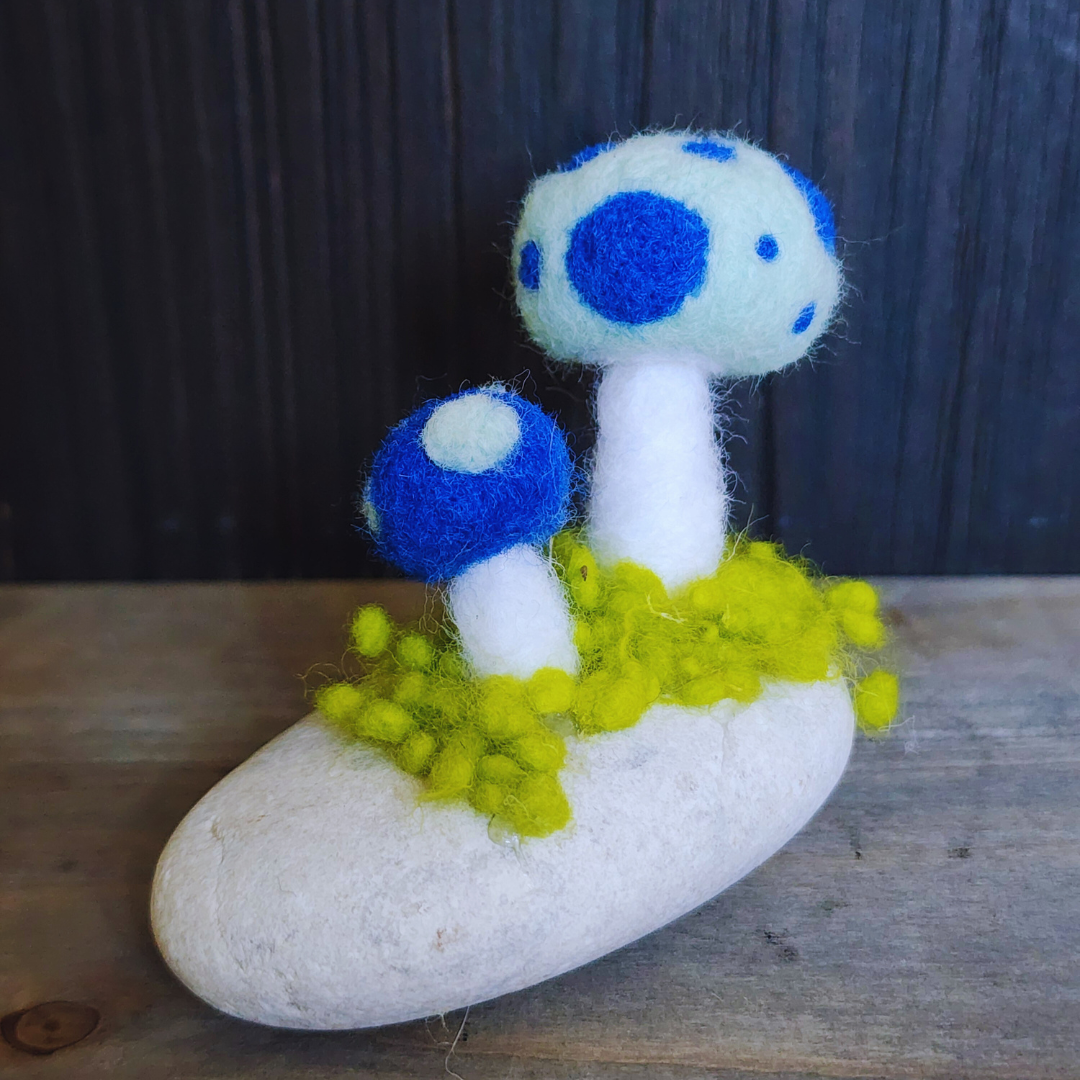 Handmade Felt Magic Mushrooms on White Granite Stone